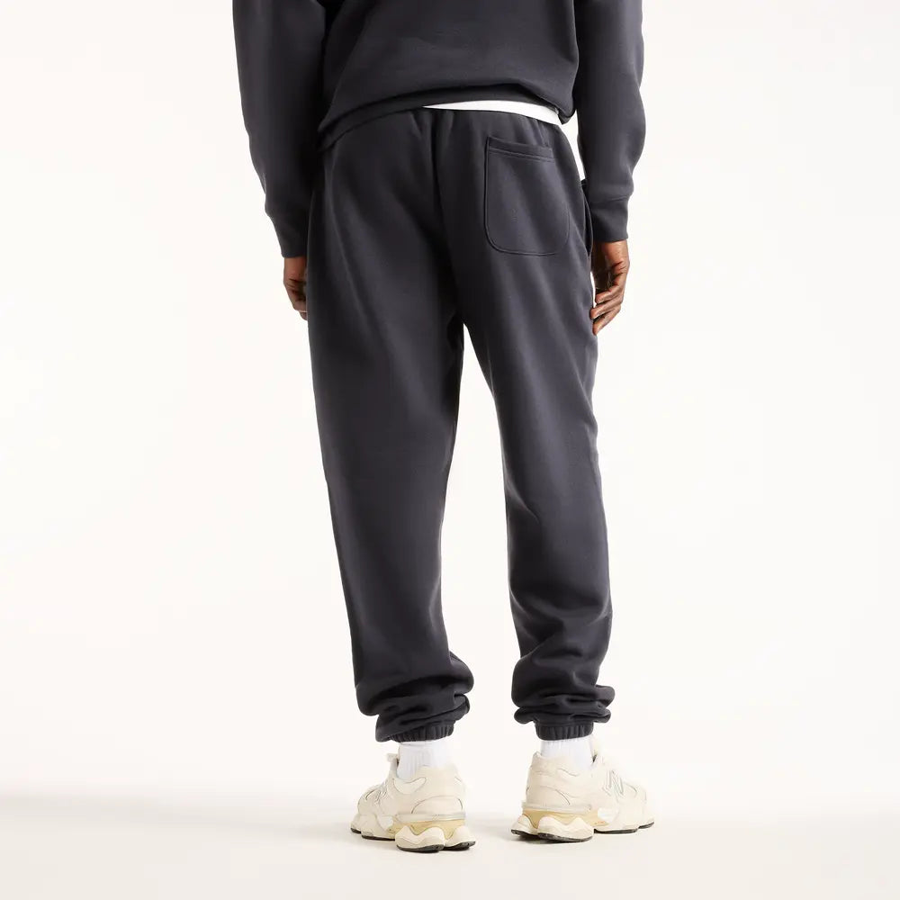 New Balance Reimagined Graphic Pant - MB62S1NTDNT